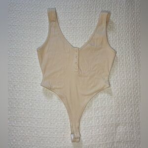 Cream color Bodysuit, brand new never worn.